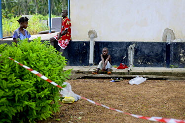 Patients suspected of being infected with Ebola sit in the courtyard of the Arab Hospital in Makeni.   Sierra Leone is one of three countries severely affected by the Ebola outbreak in West Africa whi...