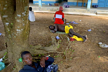 Patients suspected of being infected with Ebola lie on the ground outside the Arab Hospital in Makeni.   Sierra Leone is one of three countries severely affected by the Ebola outbreak in West Africa w...