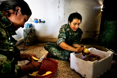 Female soldiers, from the YPJ (Women's Protection Unit), prepare potatoes fro a meal. The YPJ is a Kurdish female militia fighting the Islamic State and Jabhat al-Nusra in the primarily-Kurdish north....