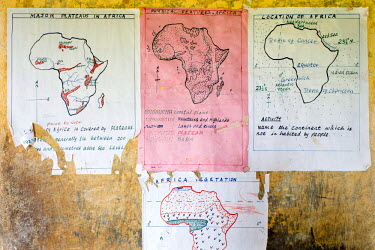 Geographical maps of Africa on the wall of a classroom at Aputiri Primary School.