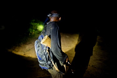 A man hunting at night in a logging concession outside the Minkebe National Park. Night hunting is illegal in Gabon but it is still a common practice in rural areas.