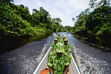 Ecoguards travel the Oua River in a patrol boat. Rivers are often used as quick ways to export poached Ivory and bush meat out of the jungle.