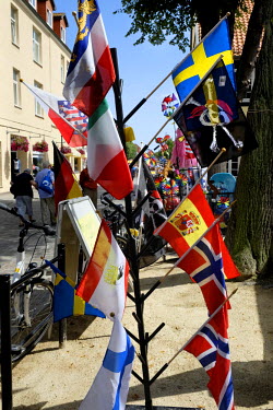 Flags for sale at a tourist souvenir shop.