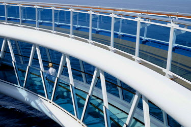 Tourists on board a luxury cruise liner. These vast ships carry thousands of passengers and thousands more staff to cater for their every need.