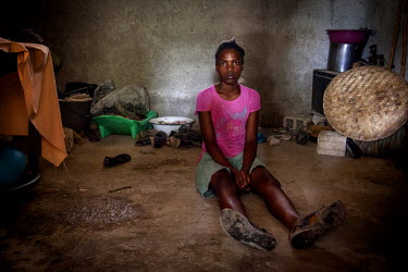 Jenica (17), an orphan and a 'restavek', sits on the floor in the place where she sleeps every night in the house of her host family of five. The family took Jenica from her aunt when she was three mo...