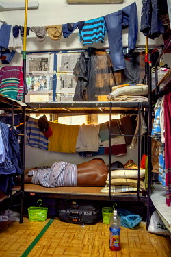 A worker's dormitory that houses mostly migrants from Bangladesh and India. Many such accommodations are illegal, have very poor security and hygiene and are usually overcrowded.