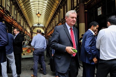 Lunchtime in the City of London, businessmen in Leadenhall Market,