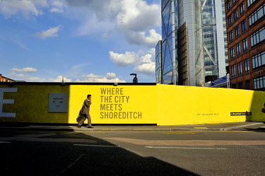 'Where the City meets Shoreditch', a slogan on hoarding at a development site between Shoredicth and the City in the East End.
