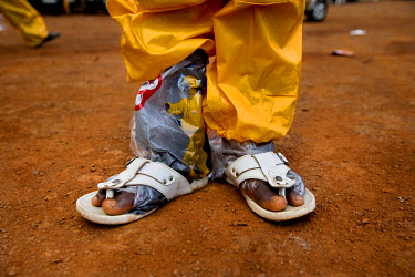 A man whose work it is to clean an ambulance used to carry ebola patients wears a Personal Protection Equipment (PPE) suit, but unfortunately the ambulance service does not have the resources to equip...