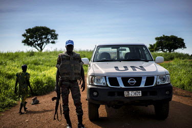 A Beninois peacekeeper accompanies a UNHCR/IEDA team on their journey to research human rights violations at Kasonsa village, far up the Congo and Luvua Rivers in Katanga Province. Dubbed the 'Triangl...