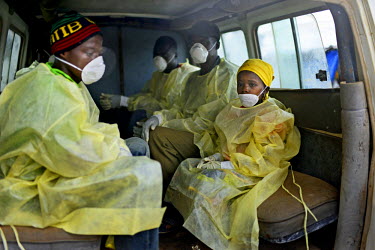 Villagers, including young Pauline Sakou, all with Ebola symptoms wait in the back of a vehicle that will take them to a treatment centre. The sick villagers made themselves known to visiting medical...