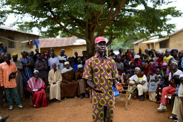 The chief of the village of Dzomankoidu, Amara Cisse, meets with members of the Red Cross in the village square. Prior to this negotiated visit by the Red Cross the villagers had denied the existence...