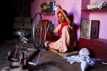 Suki (not her real name), spins cotton in her house in Jhaju village. Now 20, Suki was married the age of 12, but only went to live with her husband when she was 14. She, and her two sisters, aged 10...