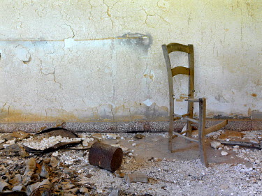 A broken chair in the deserted village of Agios Nicolaos, from where its Greek Cypriot inhabitants fled in 1974. It is now in the UN Buffer Zone that separates the Greek and Turkish parts of the islan...