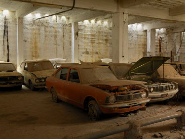 Decaying cars, abandoned in the underground carpark beneath Maple House a shopping centre on the 'Green Line', a buffer zone, that divides Turkish Northern Cyprus and Greek Southern Cyprus, establishe...