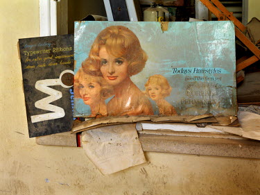 Remnants of a shop's stock and advertisements in an abandoned building inside The Buffer Zone that divides Turkish Northern Cyprus and Greek Southern Cyprus. The building is known as the 'Magic Mansio...