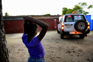 Phoebe watches the ambulance that is taking her sister to the Ebola Treatment Unit. Mary was moved from the ICC (interim care centre) after she developed a high fever. Phoebe (6) and Mary (15 months)...