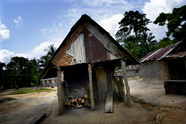 The man brought ebola to Taylor Town was taken to this kitchen building after he died where his body was ritually washed, oiled and laid on top of the planks. Phoebe (6) and Mary (15 months) are two g...