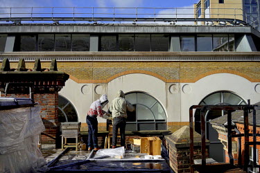 Beekeepers Chris Barnes and Paul Webb inspect their hives kept on top of Cafe Spice Nameste in the City of London. This is the final hive inspection, to check for disease or other problems, before the...