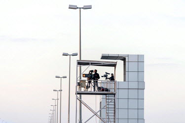 Television cameras for coverage from a tower above the race track. Most people watch the sport on television and gambling on the outcome of races is strictly forbidden.