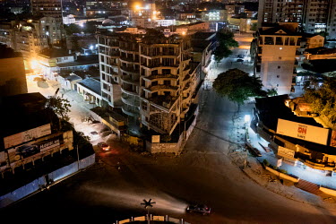 An aerial view of an intersection in Kinshasa at night.