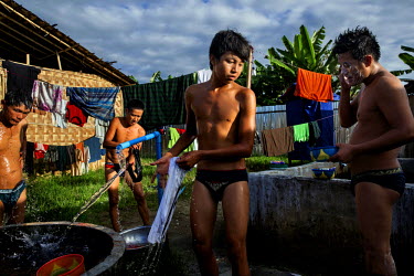 Recovering heroin addicts washing at a residential rehabilitation facility run by the Kachin Baptist Convention (KBC). Kachin state, where most of Myanmar's jade comes from, has some of the highest ra...