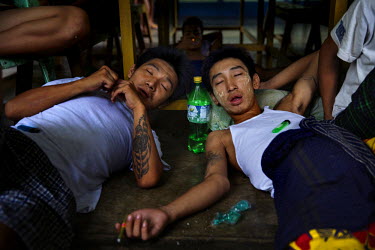Recovering heroin addicts doze in front of the TV, taking their methadone medication, in a government rehabilitation facility. Kachin state, where most of Myanmar's jade comes from, has some of the hi...