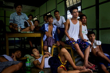 Recovering heroin addicts watch TV in a government rehabilitation facility. Kachin state, where most of Myanmar's jade comes from, has some of the highest rates of heroin use and HIV infection in Myan...