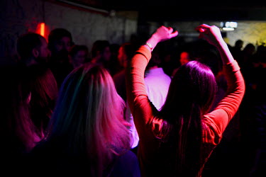 people dancing at a bar/disco.