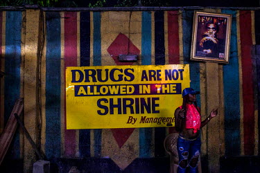 A sign reads 'Drugs are not allowed in the Shrine' at the Sunday Jump concert by Femi Kuti at the African Shrine club.