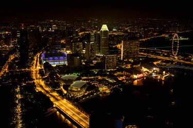 The skyline of Singapore lit up at night time. With a growing urban population, high-rise buildings are an increasingly prevalent feature cities across the world. Land is a major constraint in most As...