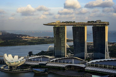 A view of the Skypark on the roof of the Marina Bay Sands Hotel overlooking the Singapore skyline. The SkyPark, 200m above ground level, is larger than three football pitches and has an observation de...