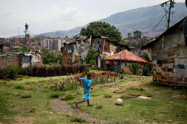 One of the remaining families on the ^hill^, the site of a new garden planted on top what was once Medellin's largest garbage dump. Since 2012, the city of Medellin has adopted an innovative project i...