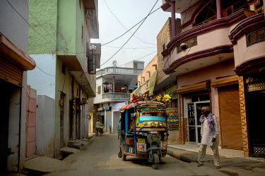 A small rickshaw taxi on a street in Panipat.