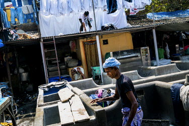 Men at work in Dhobighat, the open air area where the city's laundry is washed by an army of dhobis (washerman). It is here that the laundry for all strata of the city's society is washed by hand. Fro...