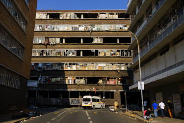 'A fire-damaged' hijacked building' (slang describing illegally occupied squat) in downtown Johannesburg. After a steep decline in the 1990s, the inner city is now a peculiar mix of interspersed worki...