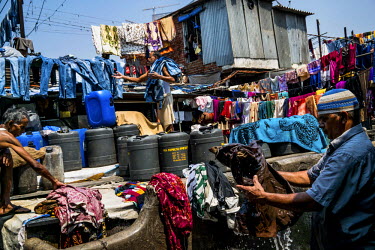 Men at work in Dhobighat, the open air area where the city's laundry is washed by an army of dhobis (washerman). It is here that the laundry for all strata of the city's society is washed by hand. Fro...