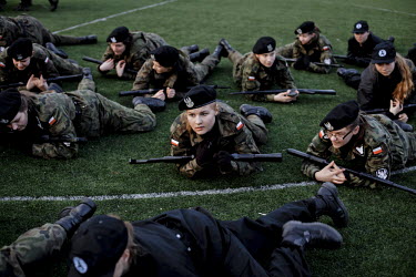 Young members of Strzelec (The Shooter), a paramilitary association, training with dummy guns on the playing field of a local school. The weekend saw a gathering of several paramilitary groups from th...