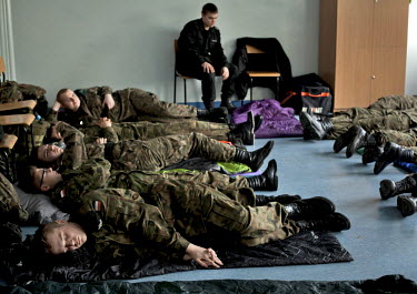 Young members of Strzelec (The Shooter), a paramilitary association, rest during a break from exercises. The weekend saw a gathering of several paramilitary groups from the region for a training sessi...