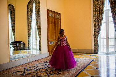 A young woman prepares for a debutante ball hosted by the Cerro-Korah favela's Pacifying Police Unit (UPP). 13 girls, all aged around 15 years old, were invited to an all expenses paid day out that be...