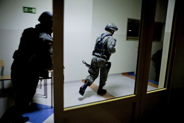 Members of Strzelec (The Shooter), a paramilitary association, race to an assembly point after an alarm sounded in the night during a training weekend. Several paramilitary groups from the region join...