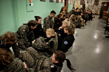 Young members of Strzelec (The Shooter), a paramilitary association, do physical exercises at 3am after waking for nightime training. The weekend saw a gathering of several paramilitary groups from th...