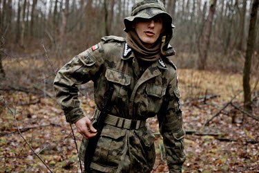 A member of Strzelec (The Shooter), a paramilitary association, during survival training in a forest. Since the start of war in Ukraine, membership of paramilitary associations has grown.