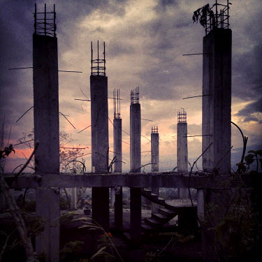 An abandoned construction project at dusk.