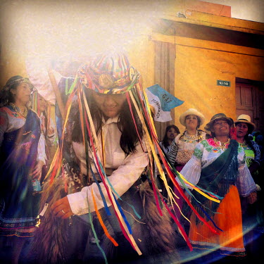 Students from Universitec dance and sing in the streets during the fiestas of Tumbaco. They are wearing traditional clothing from Cayambe.