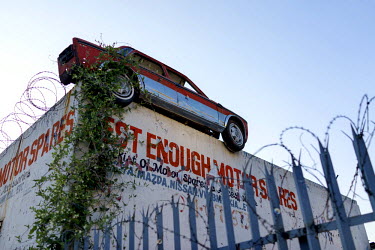 A half of a car mounted on a wall serves as an advertisement for a motor spares business in downtown Johannesburg. After a steep decline in the 1990s, the inner city is now a peculiar mix of intersper...