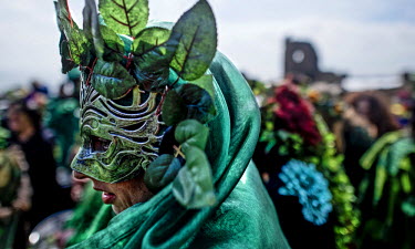 Participants at a Jack in the Green festival. The festival is part of a recent revival of an older custom where people would wear frameworks covering much of their bodies which were decked out in foli...