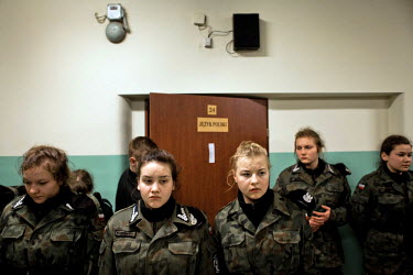 Young members of Strzelec (The Shooter), a paramilitary association, stand in line at 3am after waking for nightime training. The weekend saw a gathering of several paramilitary groups from the region...