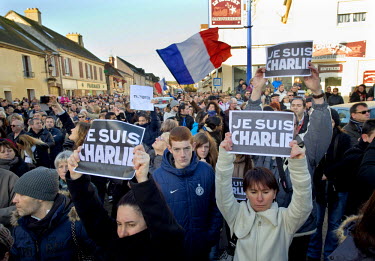 A crowd march through the village of Damartin-En-Goele where two days before two Islamist terrorists, who had stormed the offices of satirical magazine Charlie Hebdo in Paris and shot dead 12 people,...