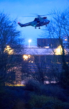 French military helicopters fly above an industrial estate in the village of Damartin-En-Goele where two Islamist terrorists, who had previously stormed the offices of satirical magazine Charlie Hebdo...